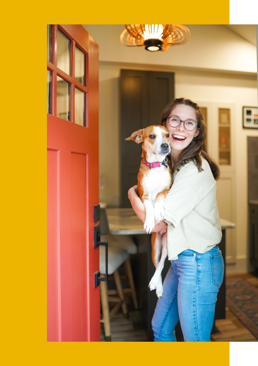 chloe-holding-dog-at-airbnb-door